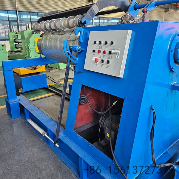 Automated steel coil processing line showing the uncoiler and feeding mechanism.