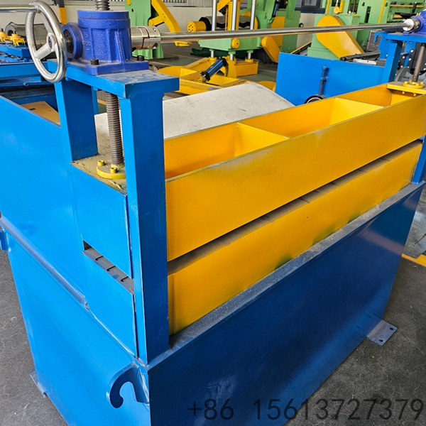Factory floor scene with a yellow safety line separating the walkway from the slitting equipment.