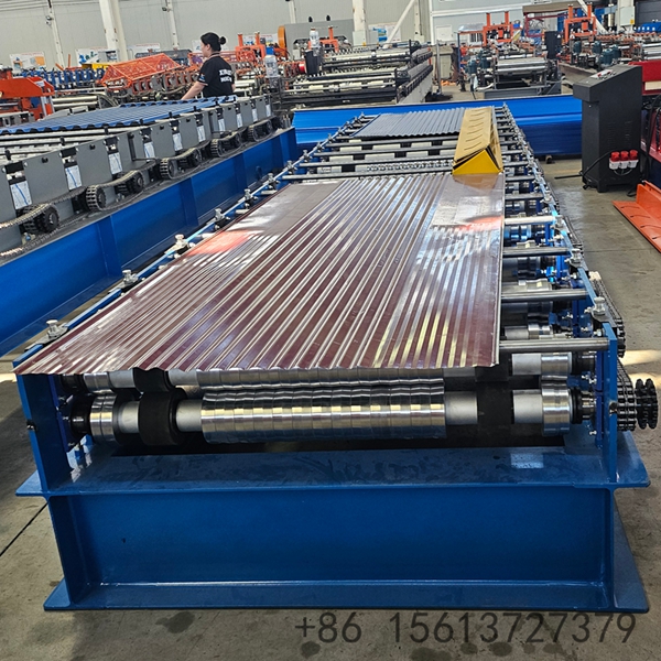 Automated corrugated iron sheet production line showing the decoiler and PLC control panel.