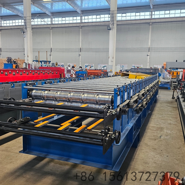 Factory floor scene with a yellow safety line separating the walkway from the tile forming equipment.