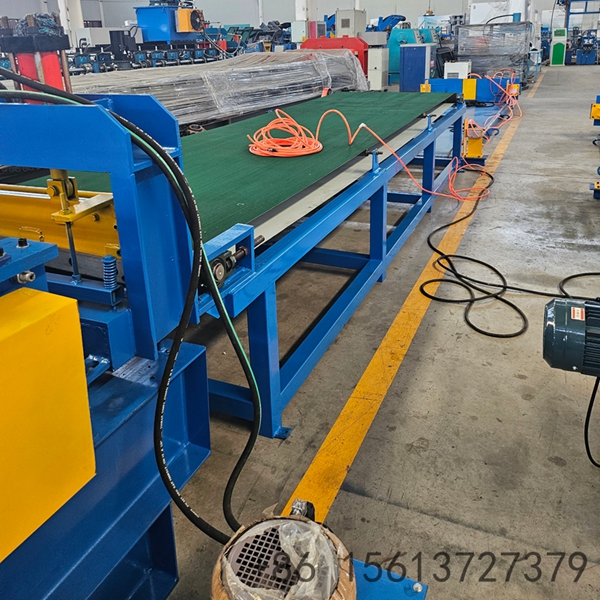 Automated cut to length production line showing the decoiler and PLC control panel.