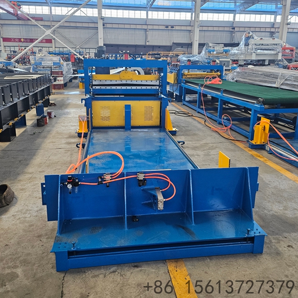 Industrial uncoiling and shearing production line processing metal coils in a modern factory.