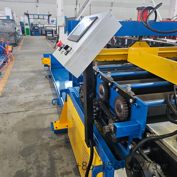 Factory floor scene with a yellow safety line separating the walkway from the shearing equipment.