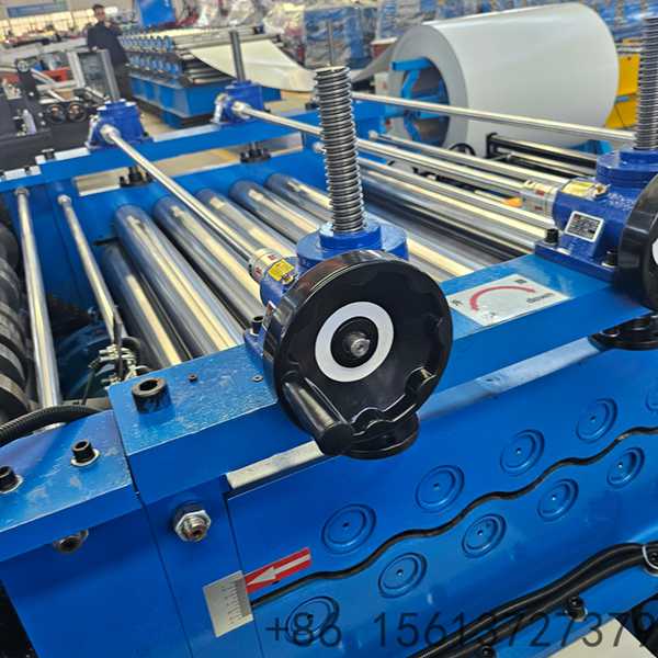 Automated cut to length production line showing the decoiler and PLC control panel.