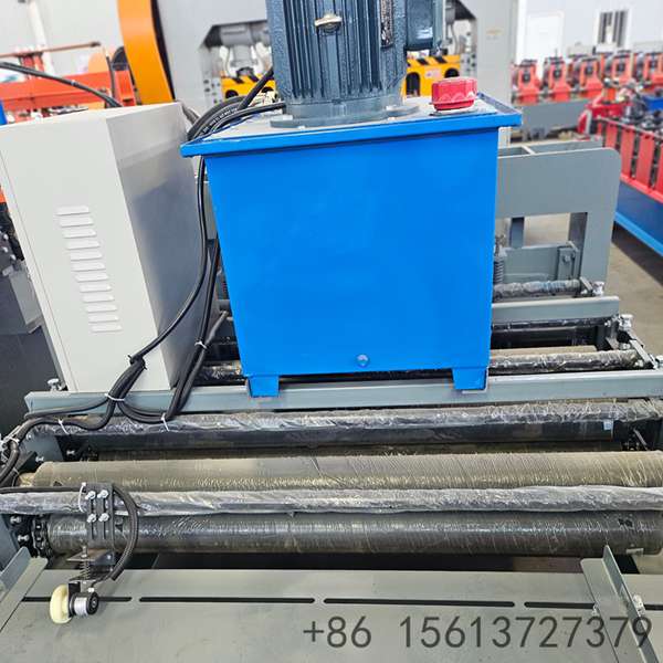 Interior view of a manufacturing plant displaying a large blue cut-to-length machine system.