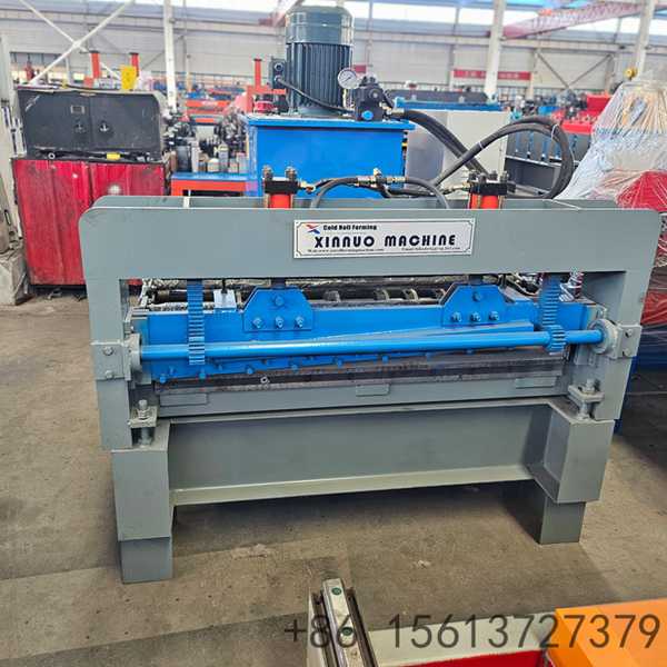 Modern industrial metalworking station equipped with hydraulic systems and electrical control cabinets.