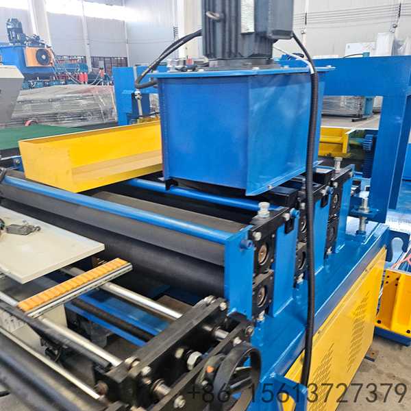 Factory floor scene with a yellow safety line separating the walkway from the shearing equipment.