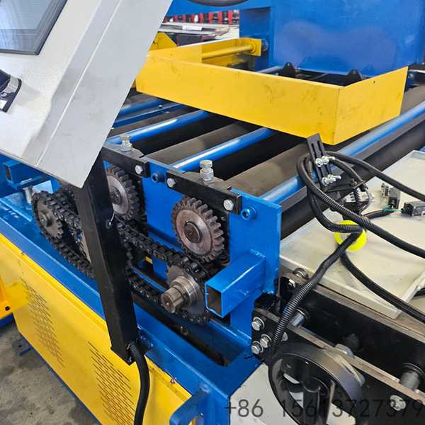 Automated steel coil processing line showing the uncoiler and feeding mechanism setup.