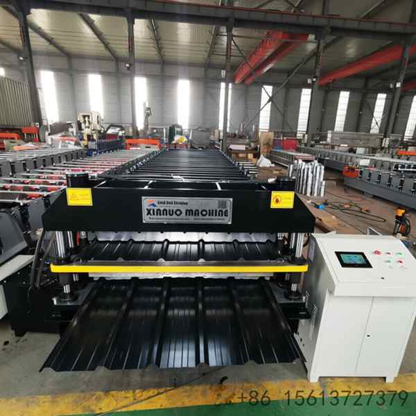 Robust industrial machinery for manufacturing durable multi-peak metal roofing panels with continuous feeding and cutting mechanisms.