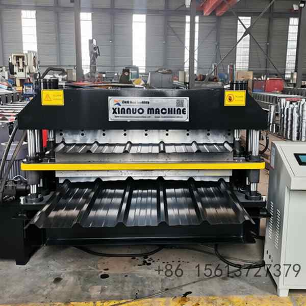Blue and grey heavy industry equipment used for forming high-strength corrugated steel tiles with dual-layer production capability.