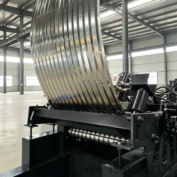 Heavy-duty steel silo manufacturing equipment featuring automatic punching systems and precision roller stations for grain bins.