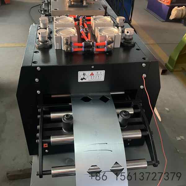 Robust industrial machinery for manufacturing durable metal light frames with continuous feeding and cutting mechanisms.