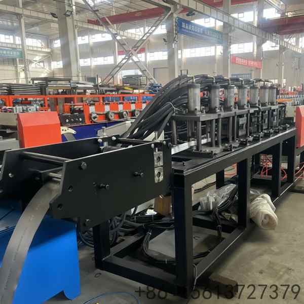 Blue and grey heavy industry equipment used for forming customized aluminum light box frames with smooth edges.