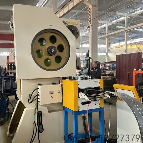 Blue and grey heavy industry equipment used for punching and forming durable steel columns for commercial warehouse racks.