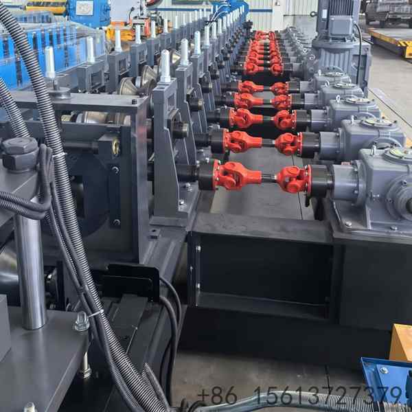 Full view of high-speed automatic triangular keel roll forming machine in industrial charcoal grey.
