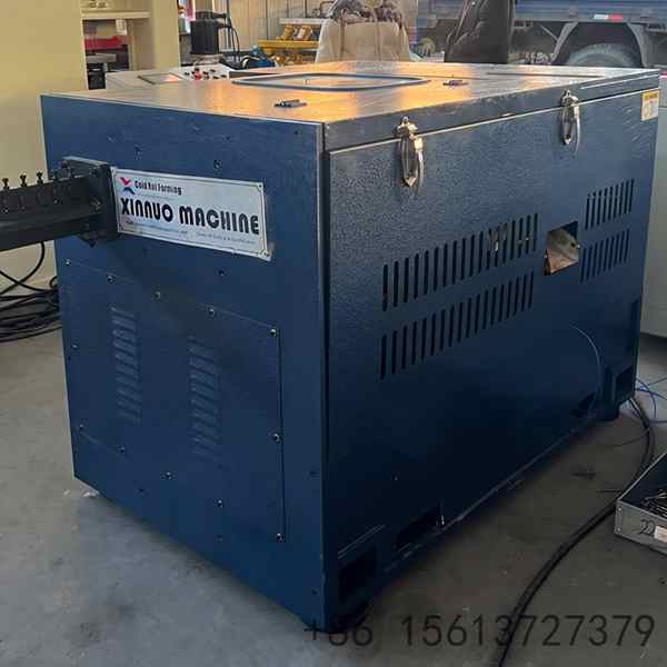 High-speed automatic wire nail making machine in professional industrial blue.