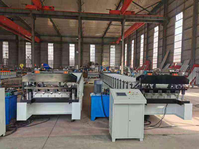 Automated TR4 floor deck forming line producing high-strength steel sheets for commercial and industrial building construction.