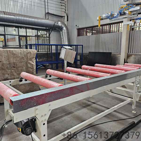 Neatly stacked metal roof panels ready for strapping on the automatic stacking machine