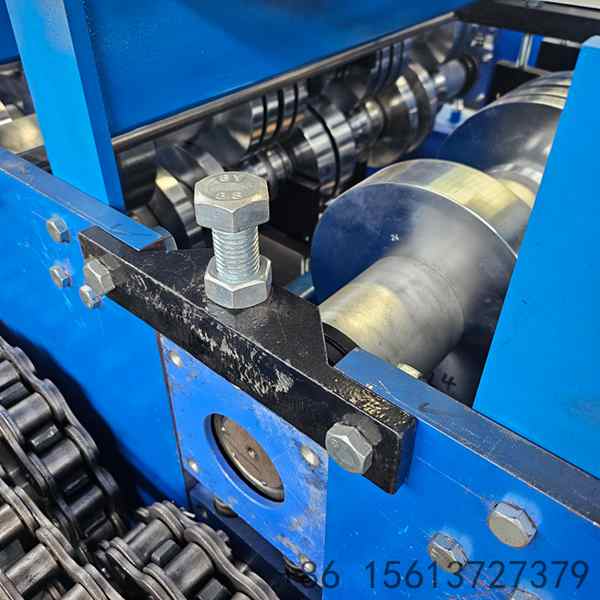 Precision roll forming station with multiple roller stations ensuring accurate floor deck profile shaping