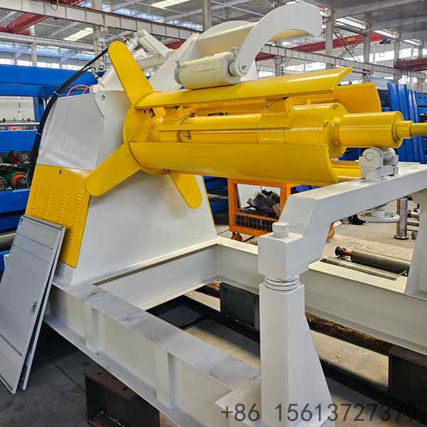 Fully loaded 7T industrial decoiler processing a wide galvanized steel coil in a manufacturing workshop