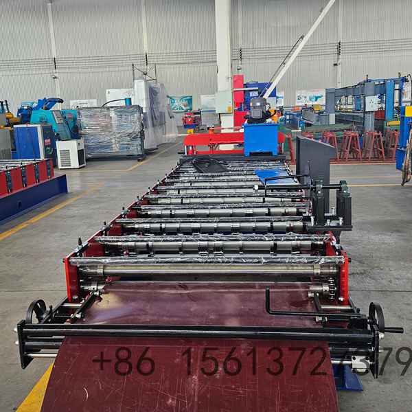 Automatic standing seam roll former featuring a robust steel frame and multiple precision rollers for smooth panel forming and secure snap-lock joints.