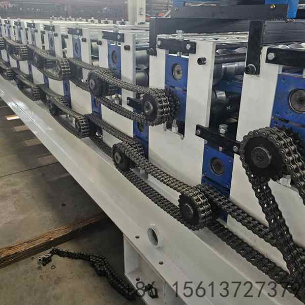 Dual-layer roll forming station with precision rollers ensuring accurate profile shaping on both upper and lower decks