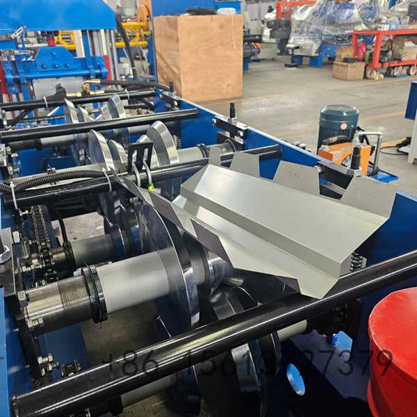 Precision roll forming station with multiple roller stations ensuring accurate ridge cap profile shaping