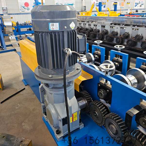 Close-up detail of a heavy-duty roof ridge cap roll forming machine, showing precision rollers continuously pressing metal coils into standard ridge cap profiles without surface scratches.