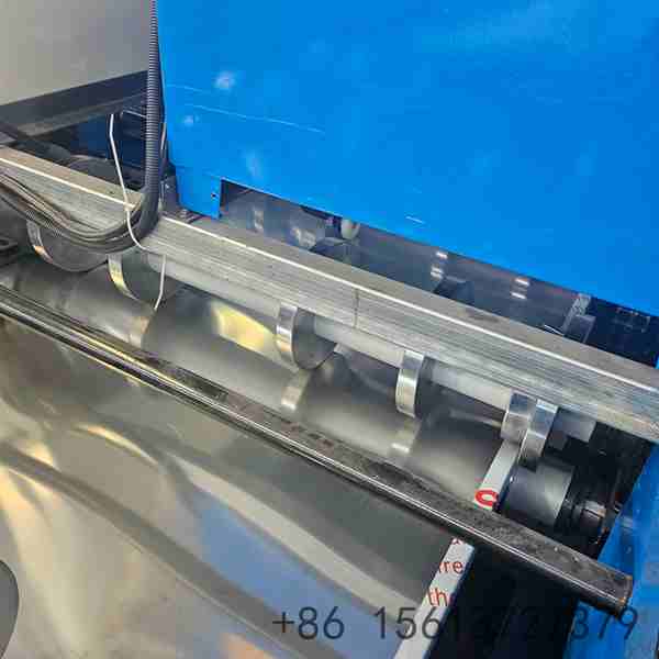 Precision roll forming station with multiple roller stations ensuring accurate wall panel profile shaping