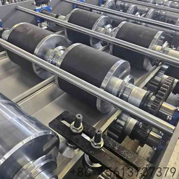 Precision roll forming station with multiple roller stations ensuring accurate standing seam profile shaping