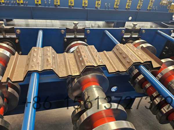 Precision roll forming station with multiple roller stations ensuring accurate TR3 decking profile shaping