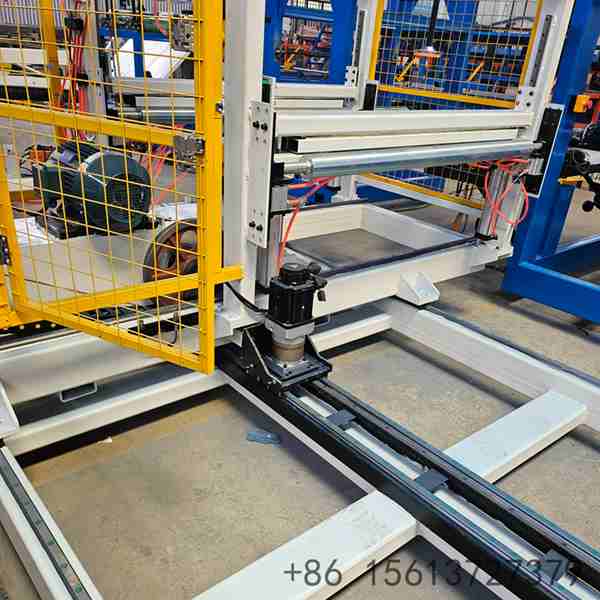 Industrial robotic arm precisely picking and placing finished composite panels onto the automated palletizing system