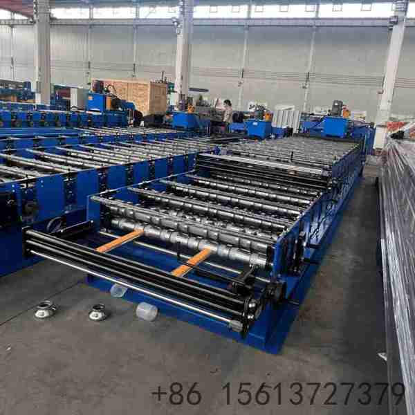 Lower layer roll forming station seamlessly shaping corrugated steel roofing sheets with high-grade forged rollers