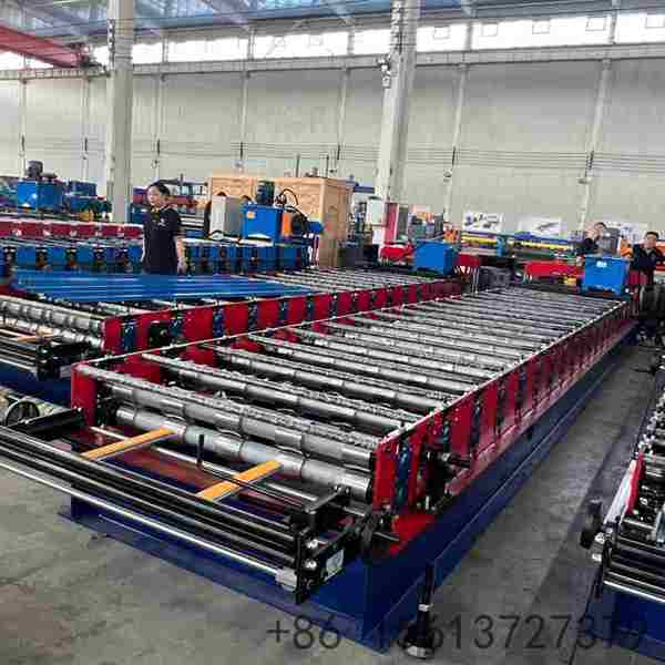 Precision roll forming station shaping the 1000 IBR profile with multiple high-grade forged rollers