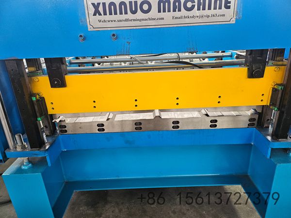 Automated decoiler and feeding guide system ensuring smooth material entry into the IBR roll former