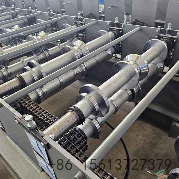 Precision roll forming station shaping the integrated snap lock seam profile with high-grade forged rollers
