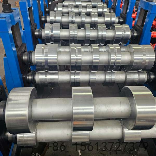 Precision roll forming station shaping the vertical standing seam profile with multiple high-grade forged rollers