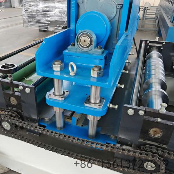 Automated decoiler and feeding guide system ensuring smooth material entry into the trapezoid former