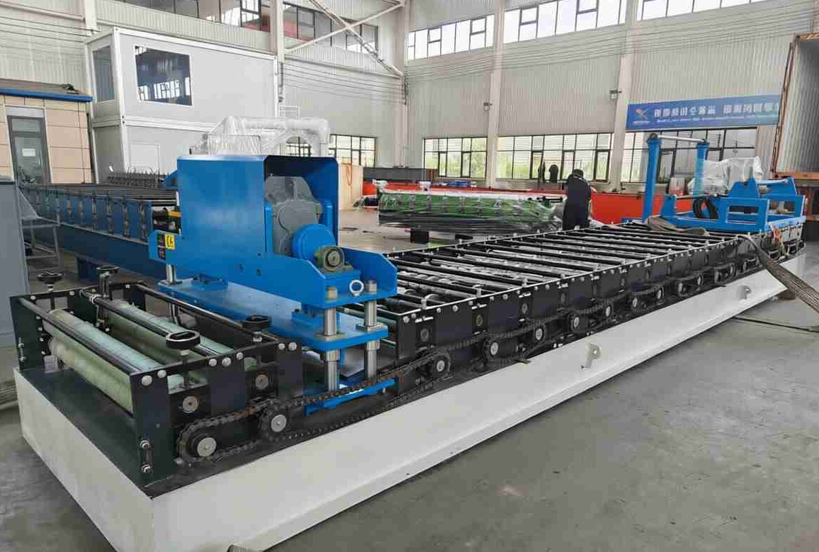 Automated decoiler and feeding guide system ensuring smooth material entry into the trapezoidal former