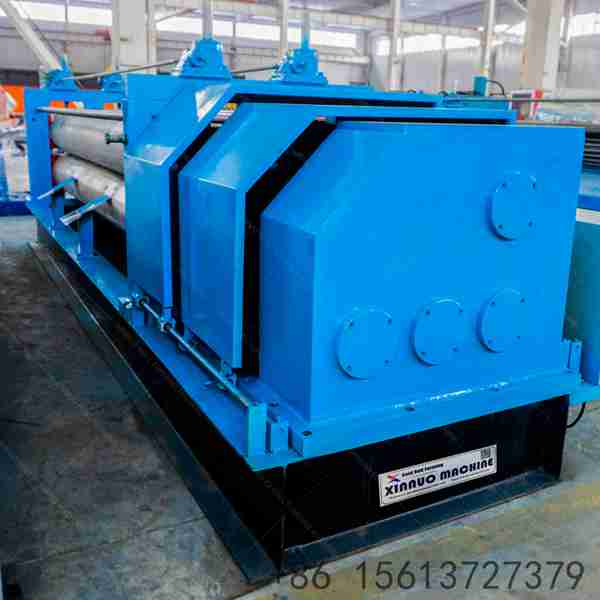 Thin-color-coated-steel-sheet-fed-into-forming-machine-in-workshop