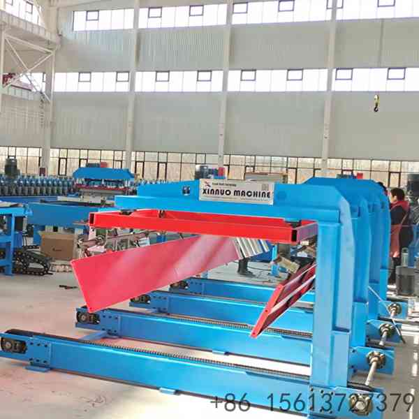 Profiled-roofing-sheet-moving-onto-stacker-infeed-roller-table