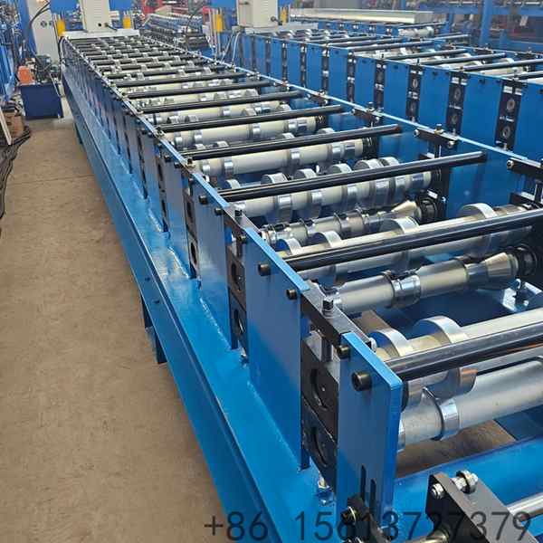 Exterior wall cladding roll forming machine overview on the factory floor set up for a building facade cladding panel