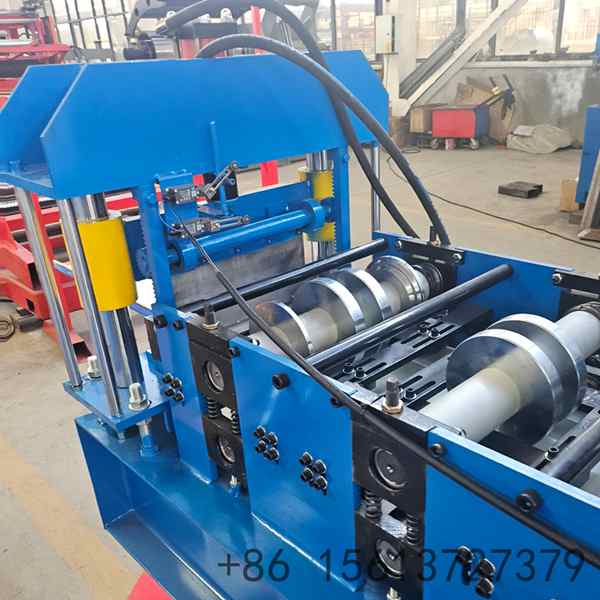 Exterior wall cladding roll forming machine overview on the factory floor set up for a wide building facade cladding panel